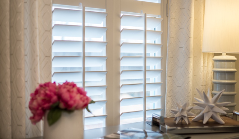 Plantation shutters by flowers in Las Vegas